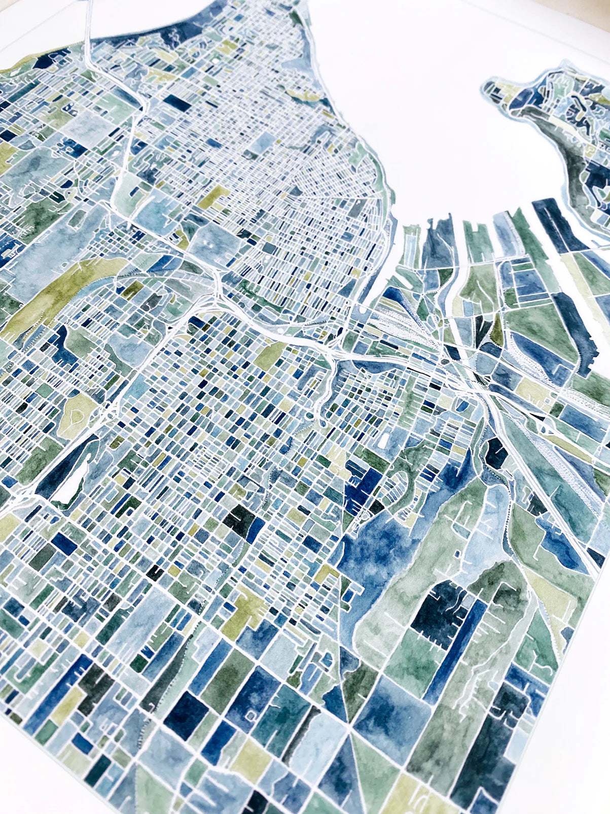 Colorful mosaic map of a city layout on a white background