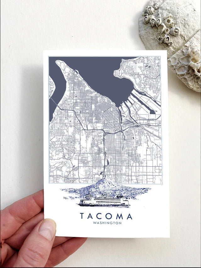 Postcard of a hand drawn Map of Tacoma, Washington held by a hand on a light background
