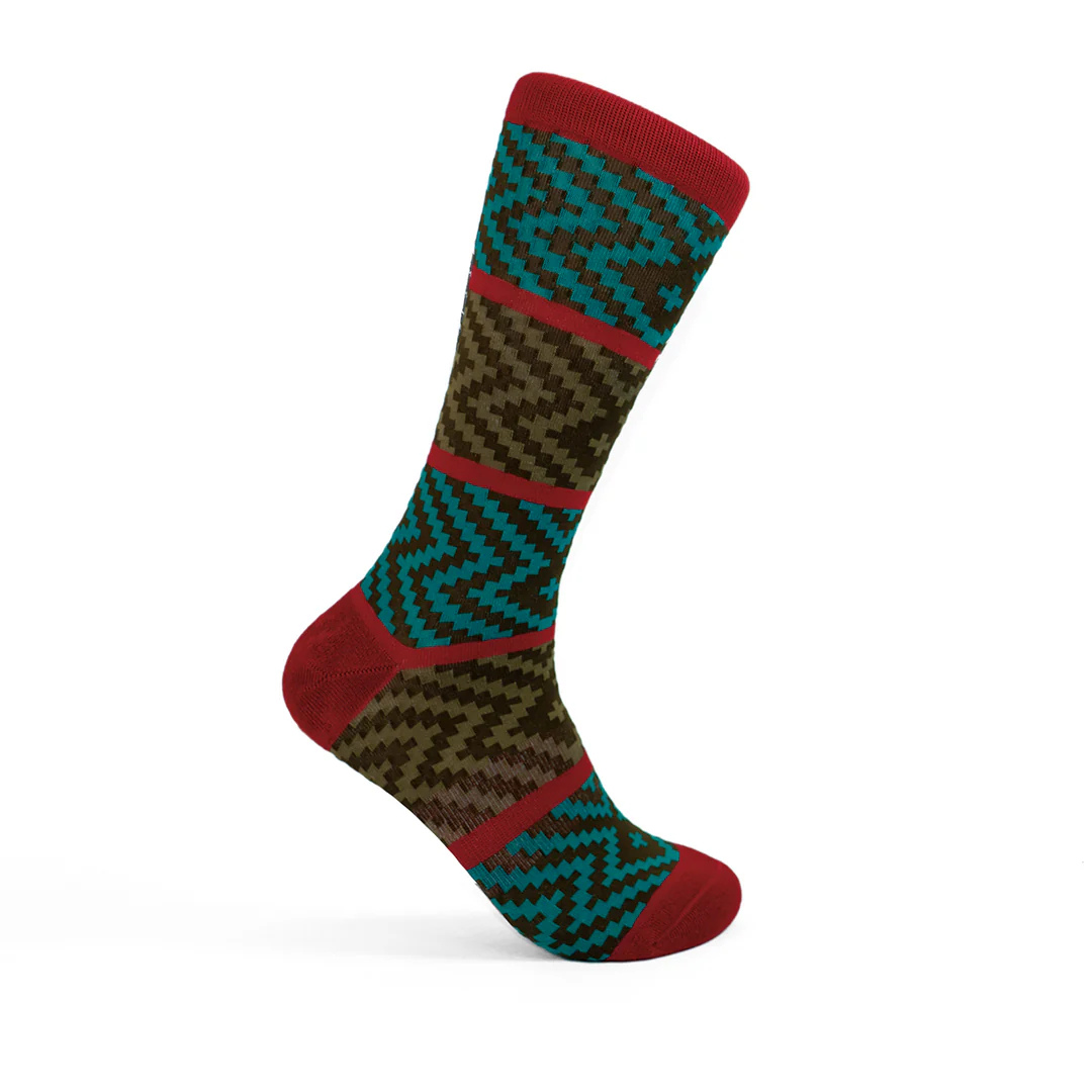 Crew sock featuring red stripes and sections of brown, teal and olive green zigzag patterns.