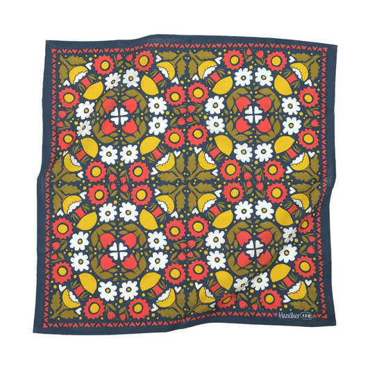 Colorful kaleidoscope designed bandana in coral, gold and olive hues. 