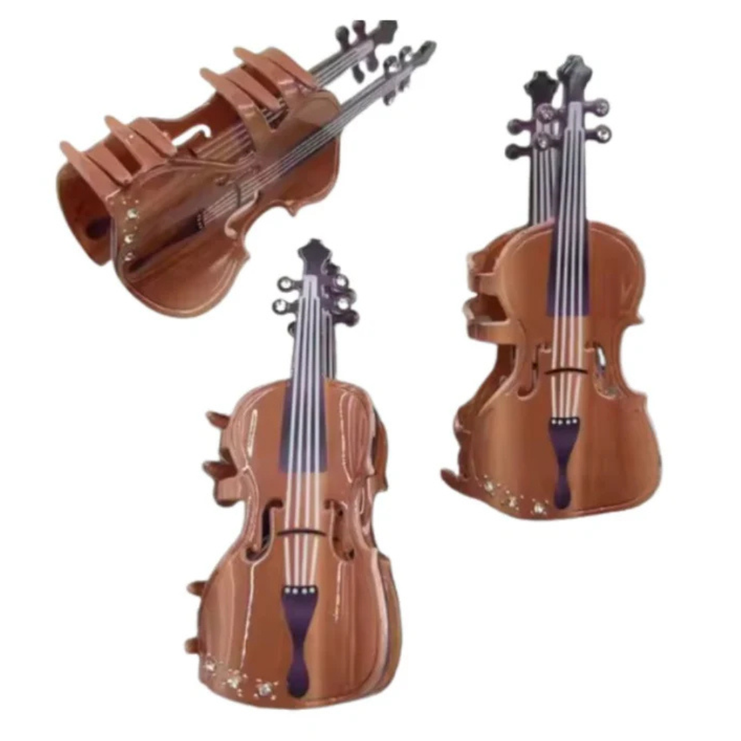 Multiple views of the cello shaped claw hair clip.