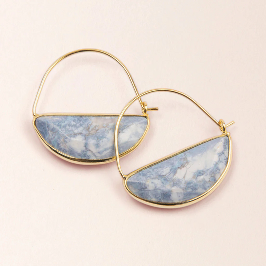 Gold hoop earrings featuring a semicircle Howlite stone filling half of the hoop.