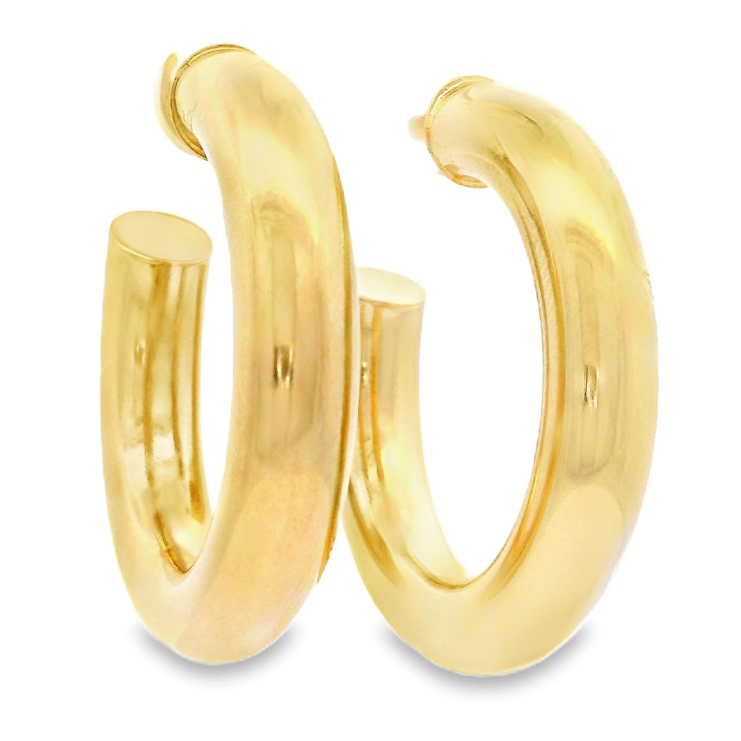 Thick gold banded hoop earrings with click closure.