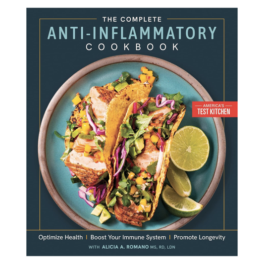 Book cover of 'The Complete Anti-Inflammatory Cookbook' by America's Test Kitchen with a plate of fish tacos on a blue background.