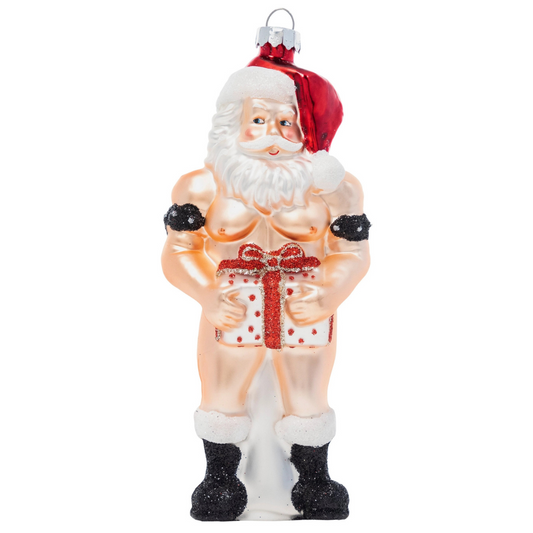 Naked Santa ornament featuring a traditional Santa wearing only a Santa hat and boots and holding a wrapped gift package of red and white.