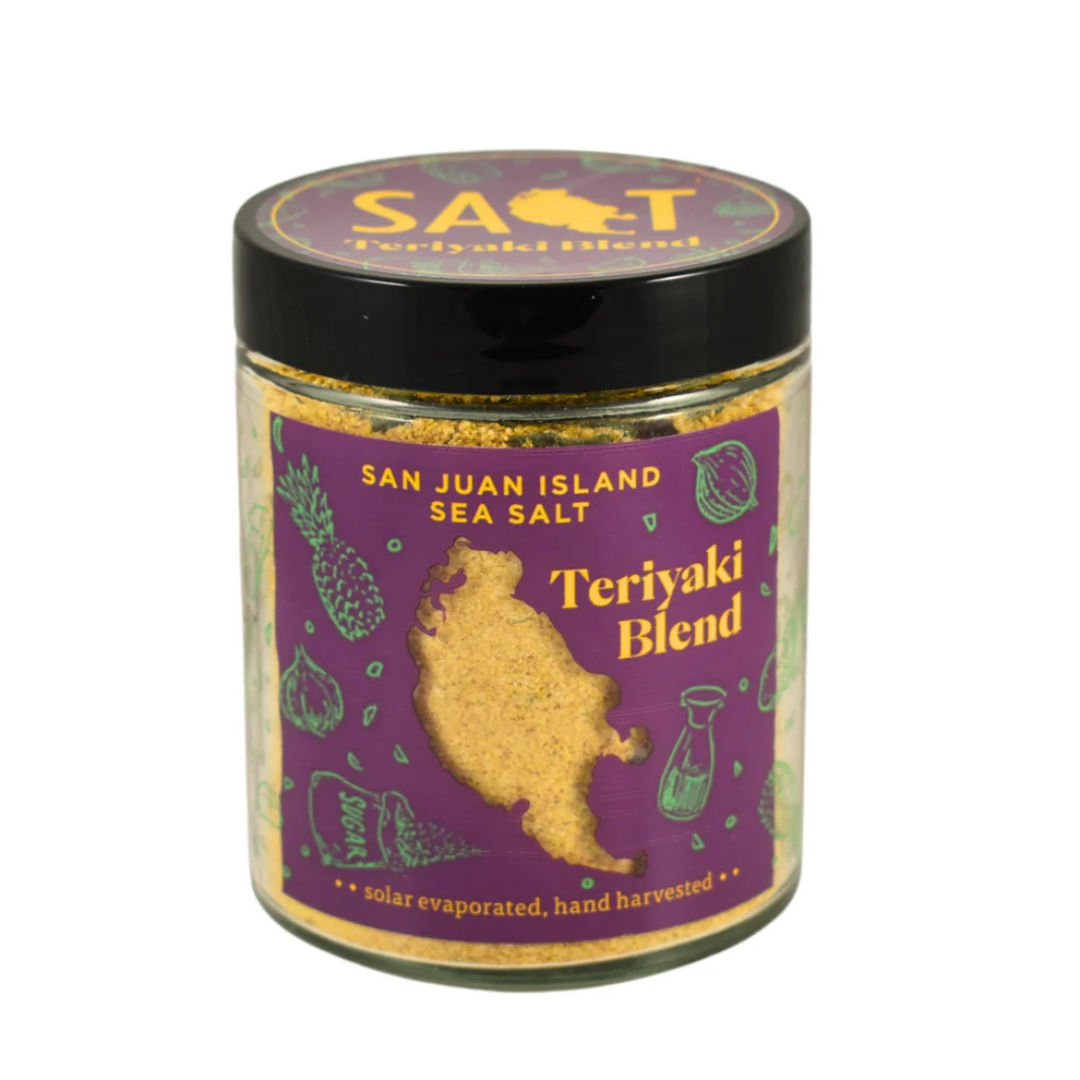 Clear spice jar with a black lid and a purple label featuring the brand's name "San Juan Island Sea Salt" and the words "teriyaki blend" beneath it.