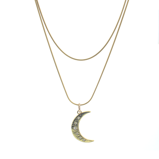 Pair of goldtone chains. Longer chain has a crescent moon shaped pendant 