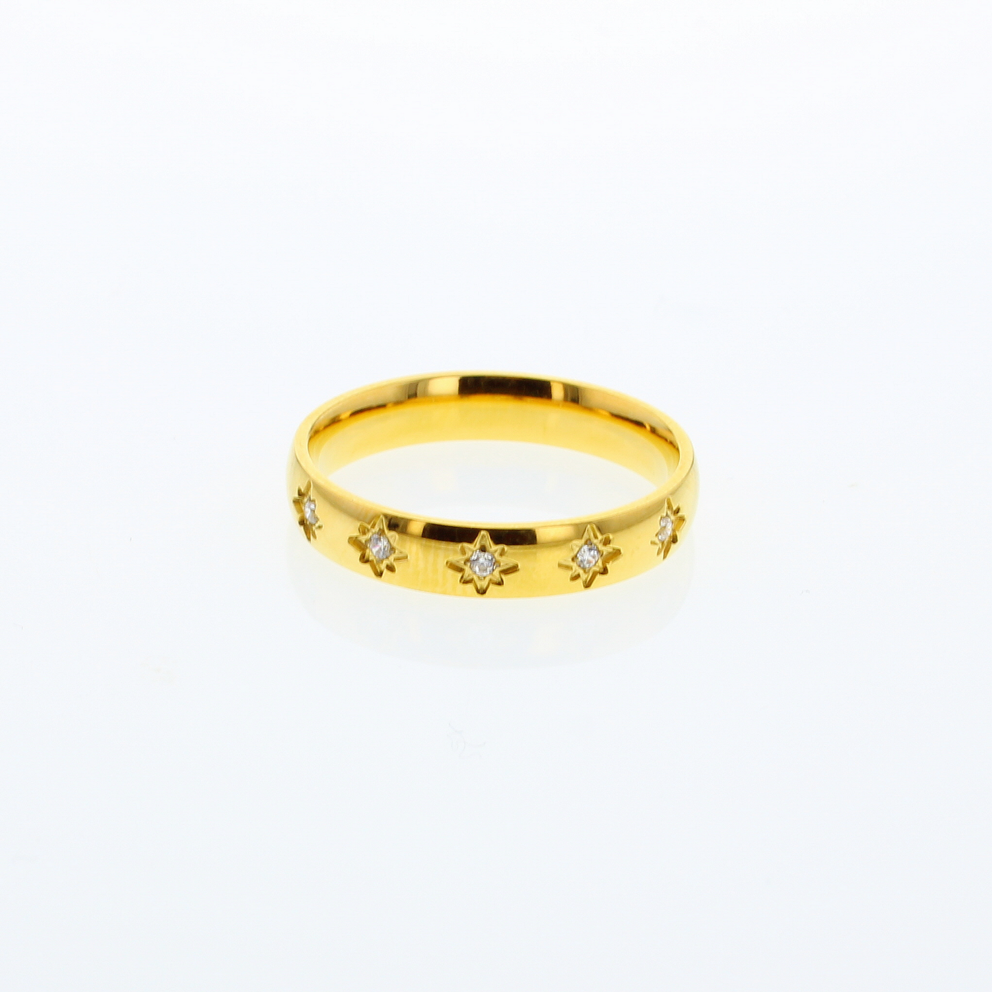 Goldtone  band style ring with small faceted clear "stone" stars