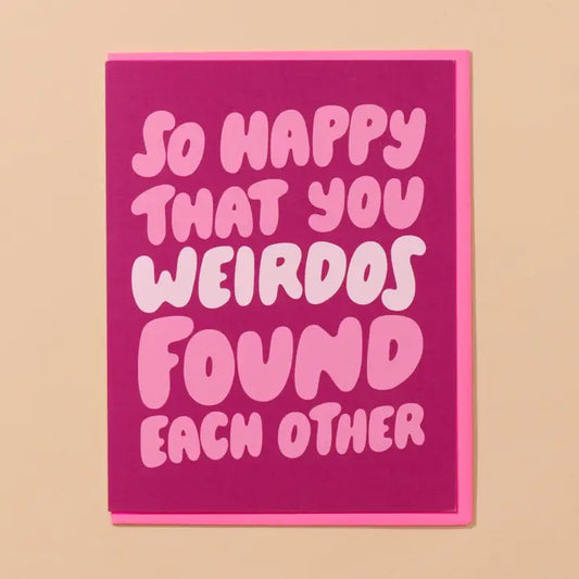 Pink card with white text on a beige background