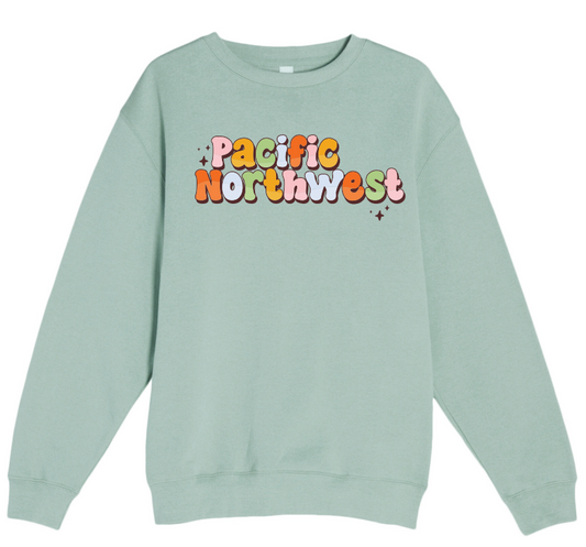 Light green sweatshirt with 'Pacific Northwest' text in colorful letters on a white background