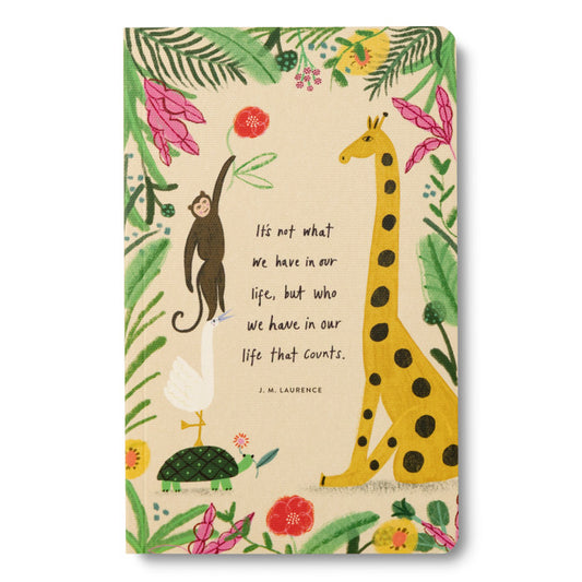 Notebook with animal illustrations and a quote on a beige background