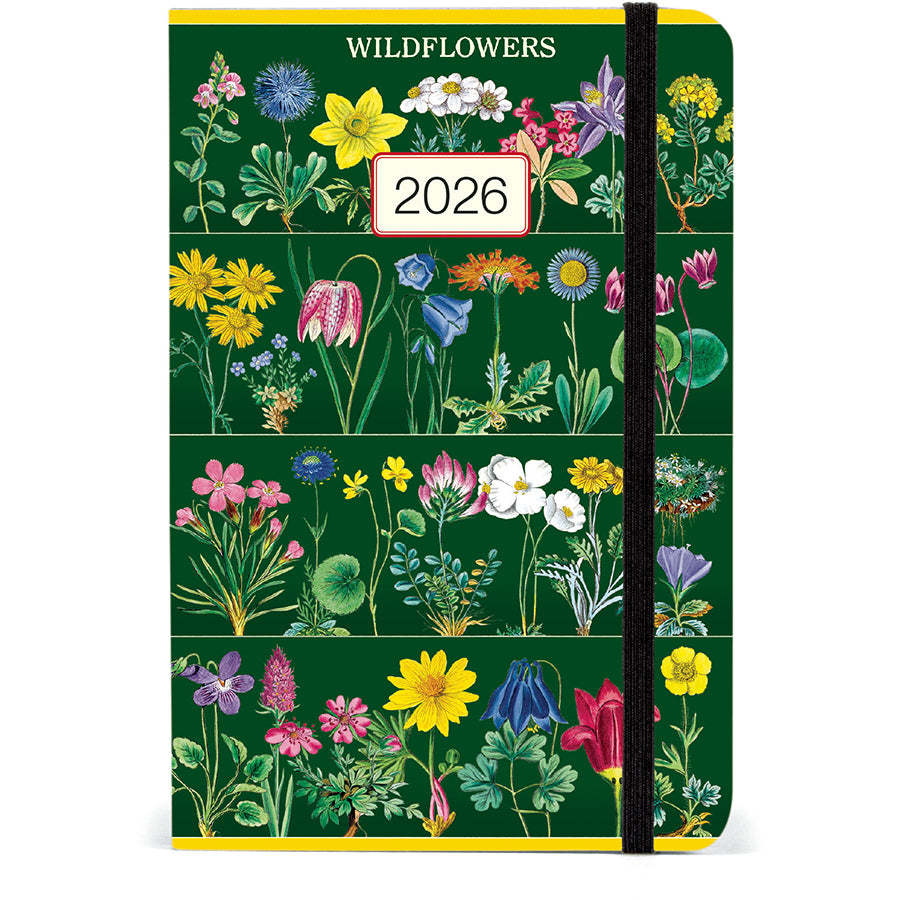 2026 weekly planner with a green cover decorated in colorful wildflowers