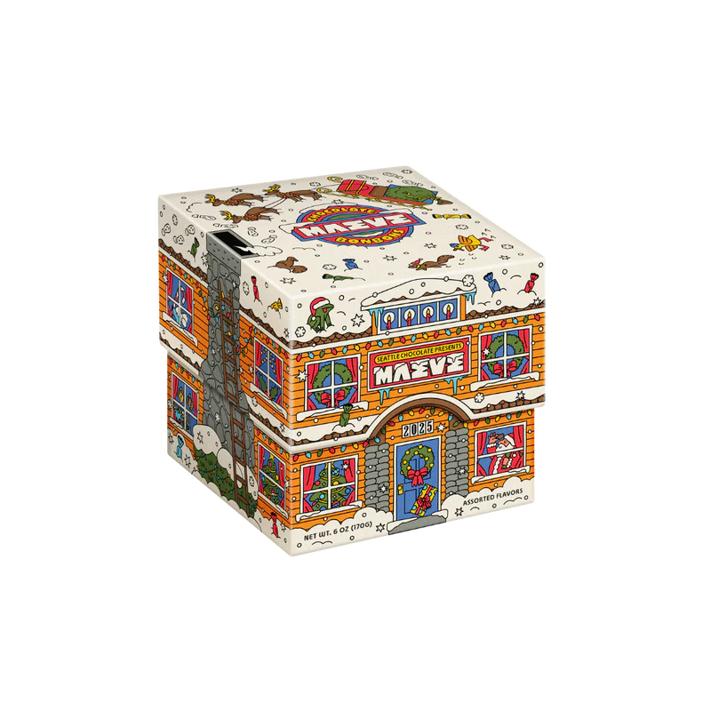 Gift box of chocolates decorated like a cute 2 story building dressed for the holidays