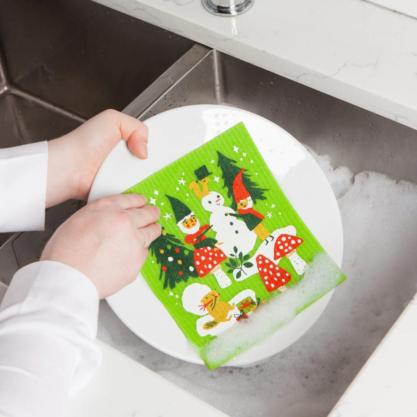 Sponge cloth being used to wash a dish