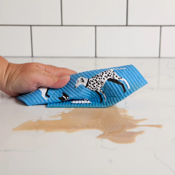 Sponge cloth being used to clean a spill