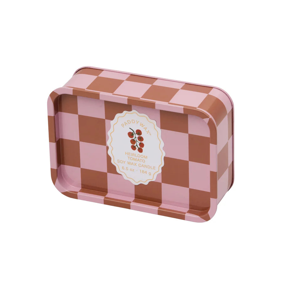 Pink and red checkered tin with a white label. Label has a vine with cherry tomatoes and reads "Paddywax, HeirloomTomato Soy Wax Candle, 6.5 oz - 184 g"