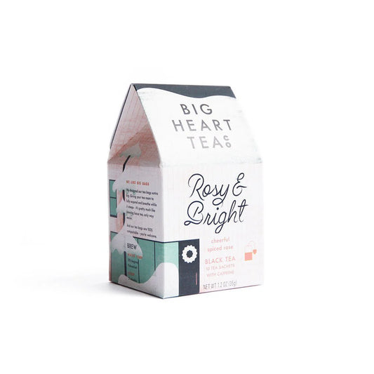 Big Heart Tea Co Rosy & Bright packaging looks like a white house in the snow