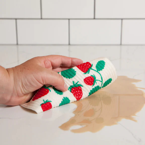Sponge cloth wiping up a spill