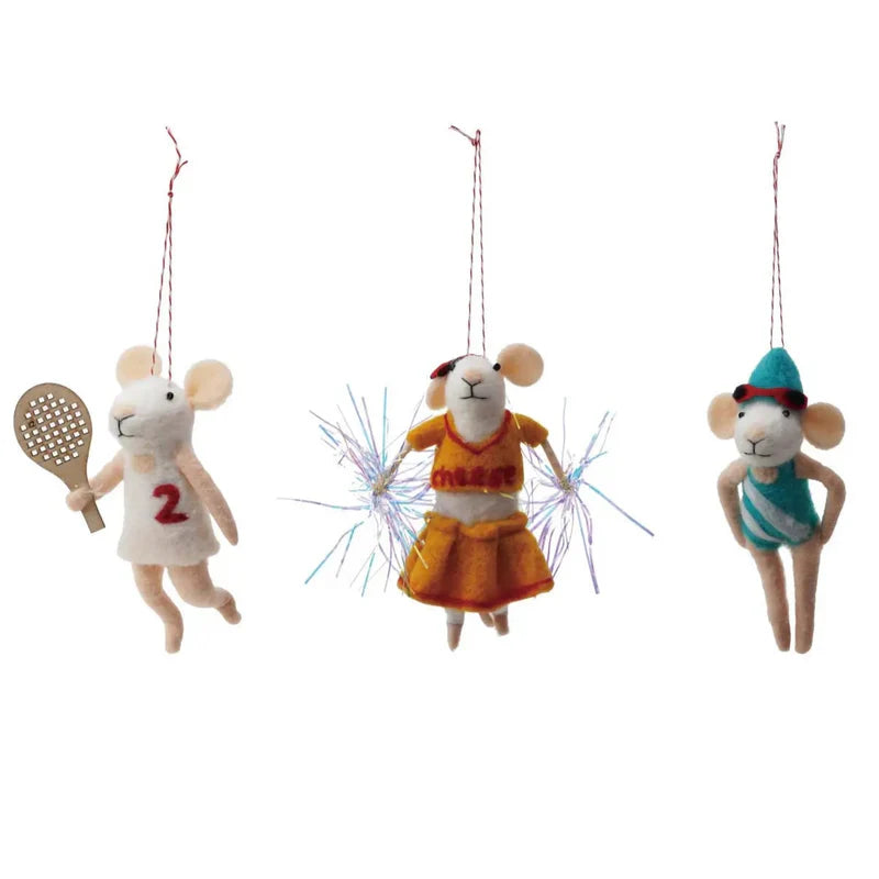 Trio of sporty mouse ornaments- tennis player, cheerleader, and swimmer. Tennis playing mouse wears a white tennis costume with a number 2 and holds a wooden racket. Cheerleader mouse wears a red and yellow uniform that says "cheese" and has sparkly pompoms. Swimming mouse wears a turquoise and white swim suit with a turquoise swim cap and red goggles.