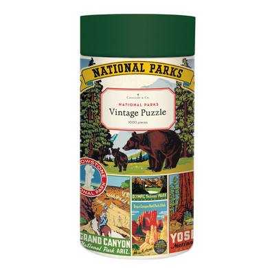 Cavallini round puzzle box with a forest green lid and cream case, adorned with vintage national park illustrations
