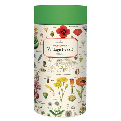 Cavallini round puzzle box with a soft green lid and cream case, adorned with a vintage flower illustrations
