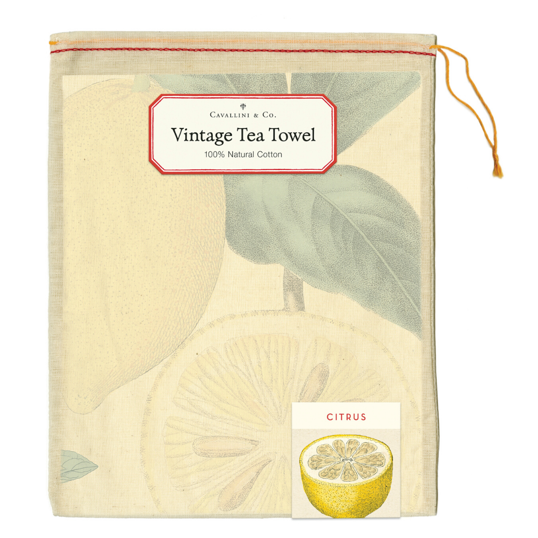Vintage tea towel with citrus design and Cavallini & Co. branding on a white background