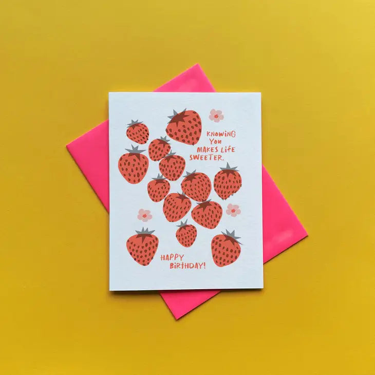 Greeting card with strawberry design and text on a yellow background