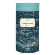 Load image into Gallery viewer, Cavallini round puzzle box with a soft blue lid and deep blue case, adorned with a star chart illustration, featuring major and minor constellations.

